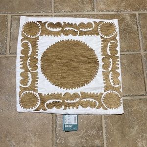 Karma Living beige pillow cover with gold embroidery.